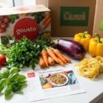 Fresh ingredients and recipe boxes spread on a kitchen countertop — the best HelloFresh alternatives UK